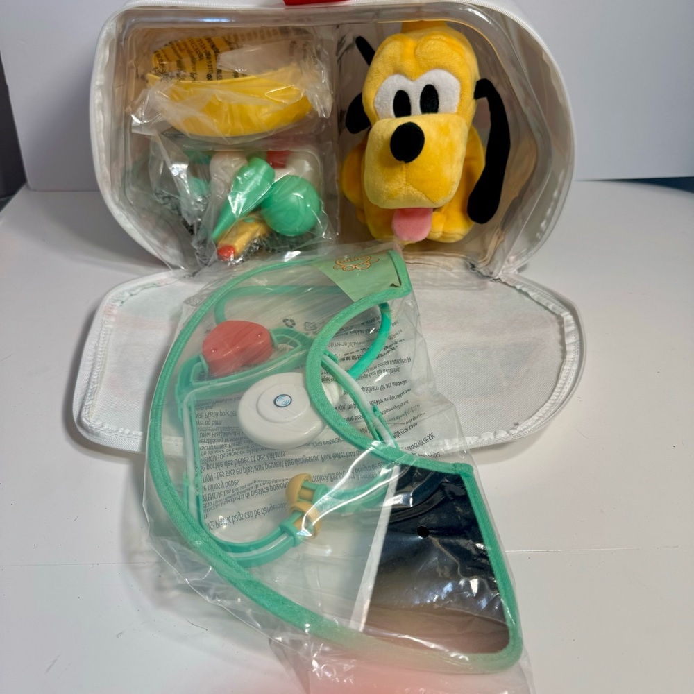 NWT. Disney Pluto Plush Vet Set is an 11-piece play set. Disney Junior - Picture 3 of 16
